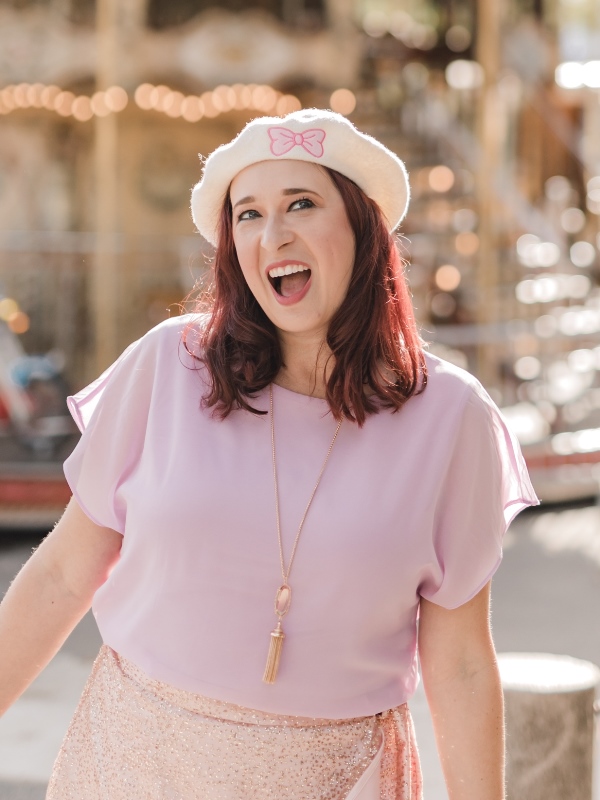 Woman wearing white hat and smiling