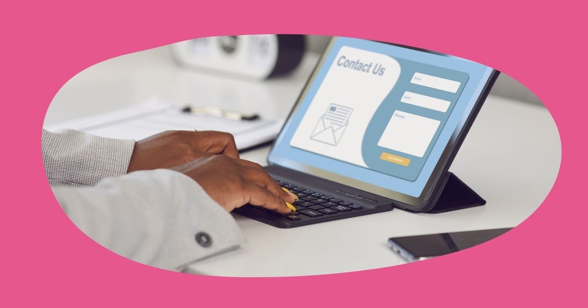 Hands typing on a laptop keyboard surrounded by pink border