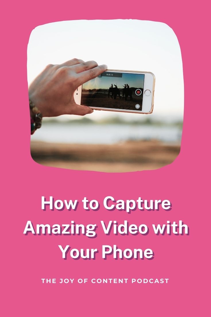 Hand holding an iphone recording video with pink background and text overlay "how to capture amazing video with your phone"